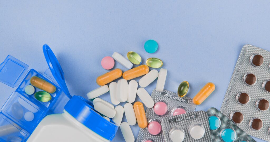 Variety medicines on blue background