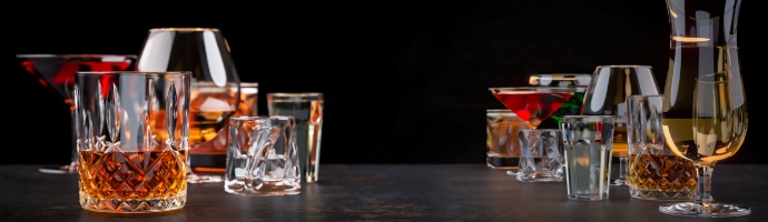 Strong alcoholic drinks on dark background